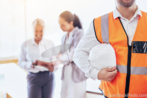 Image of Architect, safety helmet and meeting for construction planning, collaboration or management at the office. Businessman, contractor or engineer holding hard hat in leadership for architecture project