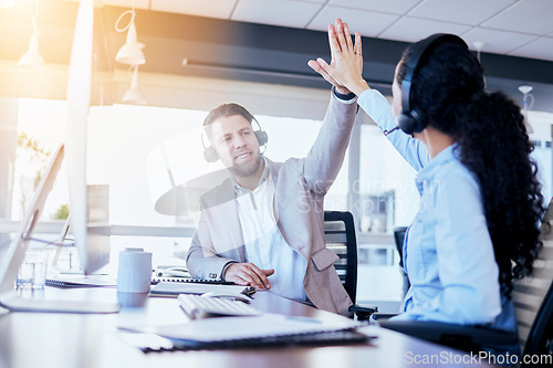 Image of Business people, call center and high five for winning, teamwork or success in customer service at the office. Employee consultants touching hands in celebration for team win, bonus or promotion