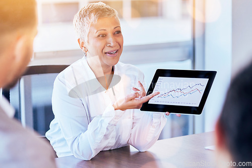 Image of Senior business woman, tablet and data of graph, chart or statistics in meeting at corporate office. Mature female manager showing company investment, profit or annual target and results at workplace