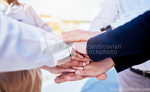 Image of Business people, hands together and teamwork in agreement, collaboration or meeting outdoors. Group of employees in team building piling hand for unity, partnership or coordination in solidarity