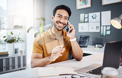 Image of Phone call, smile and planning with a business man chatting while working at his desk in the office. Mobile, contact and communication with a young male employee chatting or networking for strategy