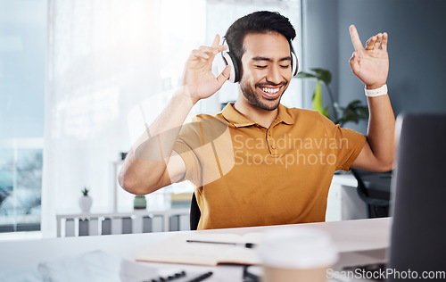 Image of Man, laptop and headphones with music during remote work, happy and enjoy listening to radio. Male copywriter, energy with blogger dancing and technology, online audio streaming and working from home