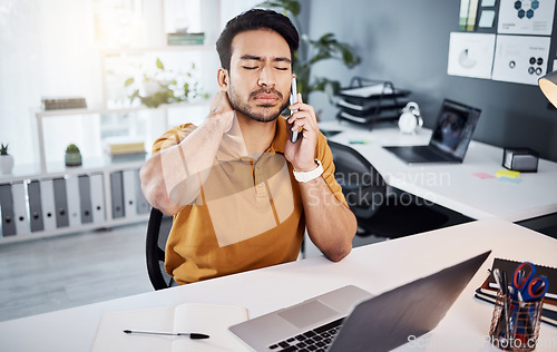 Image of Business man, phone call and neck pain or stress at office desk with a laptop and depression. Asian male entrepreneur with technology and depression, mental health or burnout while tired and working