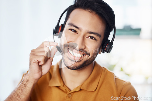 Image of Man with smile in portrait, call center and contact us with headset and microphone, CRM and help desk agent. Happy male consultant, communication and technology with customer service job and telecom