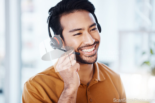 Image of Man with smile, call center and contact us with telecom, headset and microphone with CRM and help desk agent. Happy male consultant, communication and technology with customer service job and support