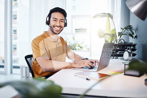 Image of Laptop, portrait and man call center agent doing research on a crm strategy in a modern office. Confidence, smile and male customer service consultant working on an online consultation with computer.