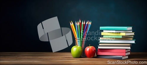 Image of Stack of books with pencils