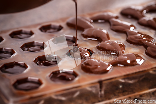 Image of Putting chocolate in mold