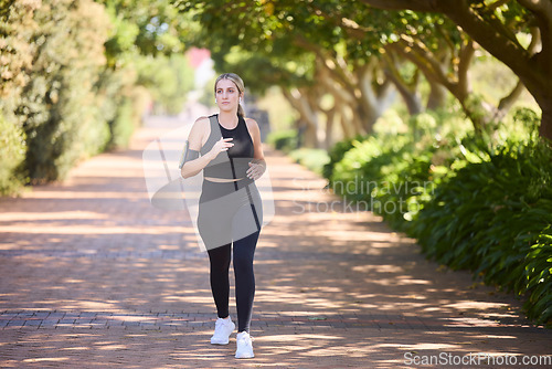 Image of Music, fitness or woman running in park training, cardio exercise or full body workout for marathon. Sports, runner or healthy girl athlete exercising on jog streaming audio or radio song in nature