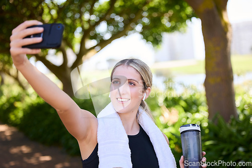 Image of Park, happy woman or fitness influencer taking a selfie at training, running or workout in a park. Smile, runner or healthy girl athlete in headphones talking pictures or photo to relax on a break