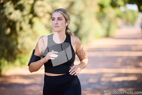 Image of Music, runner or woman running in park training, cardio exercise or endurance workout for marathon. Sports, fitness or healthy girl athlete exercising on jog streaming audio or radio song in nature