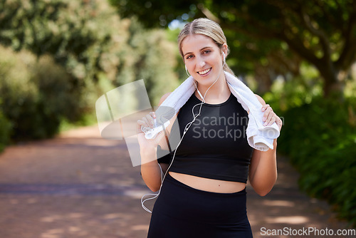 Image of Music, runner or portrait of happy woman in park training, exercise or cardio workout for a healthy body. Sports, fitness break or girl athlete exercising or streaming audio or radio song in nature