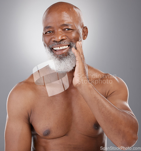 Image of Senior black man, portrait smile and skincare for grooming, hygiene or facial treatment against gray studio background. Happy African American elderly male smiling for beauty skin, self love or care