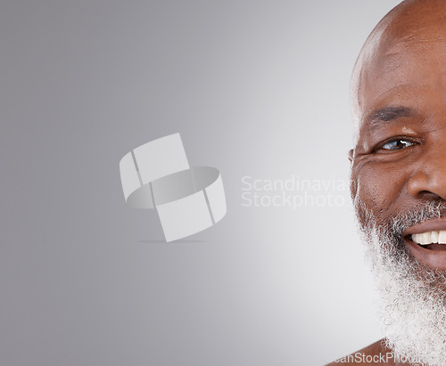 Image of Senior black man, face and smile on mockup for skincare, hygiene or grooming against a gray studio background. Portrait of happy African elderly male smiling for self love or skin care on copy space