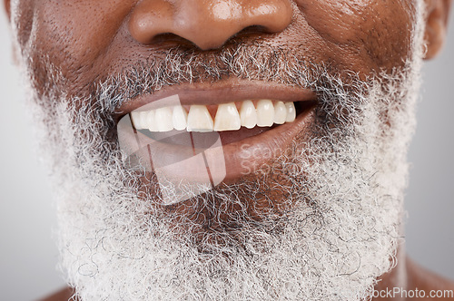 Image of Mouth, teeth and beard with a senior man in studio on a gray background for beauty, skincare or grooming. Dentist, smile and happy with a person closeup for dental care, oral hygiene or whitening