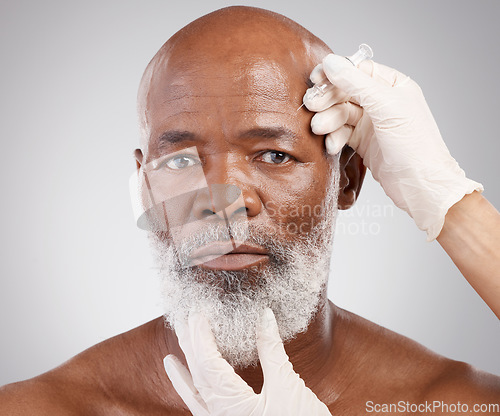 Image of Skincare, needle and portrait of man with collagen, injection and professional anti ageing face treatment. Dermatology, medical cosmetic and mature African model with hands on dermal filler syringe.