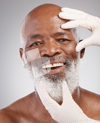 Image of Skincare portrait, face and man with gloves, happiness or professional anti ageing spa treatment in studio. Dermatology, cosmetics and mature African model with cosmetic skin care process at salon