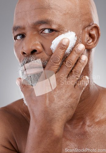 Image of Skincare cream, application and portrait of old man for wellness, cosmetics and facial creme. Dermatology, beauty and guy with anti aging lotion, face product and moisturizer on studio background