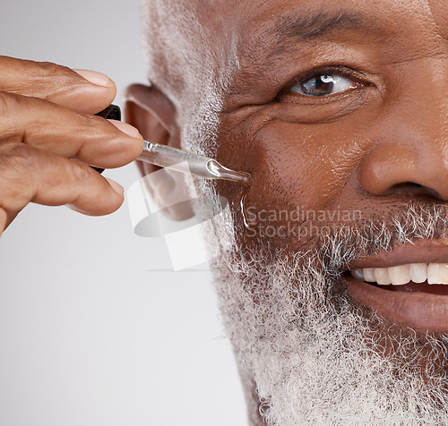 Image of Skincare, serum and portrait of senior black man in studio for wellness, cosmetics and facial treatment. Dermatology, beauty and face of guy with oil dropper for anti aging, wrinkles and hydration