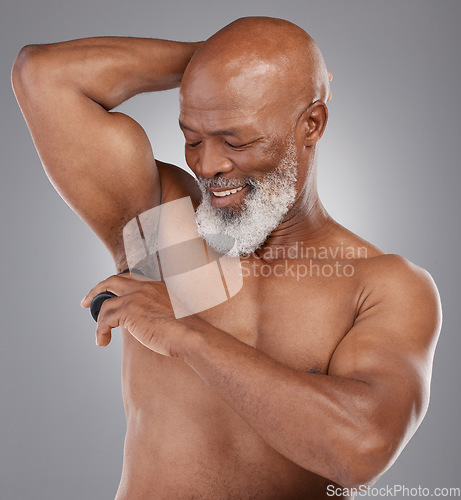 Image of Skincare, shaving armpit and black man with a smile, grooming and routine with guy against a dark studio background. Senior male, happy person and model with hygiene, cosmetics and hair removal