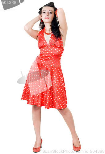 Image of The young beautiful brunette in a red dress
