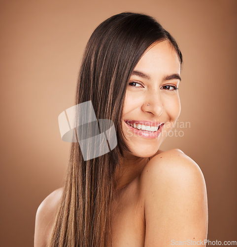 Image of Hair care, beauty and portrait of woman in studio for wellness, treatment and health on brown background. Salon aesthetic, smile and face of happy girl with cosmetics, hairstyle and natural glow