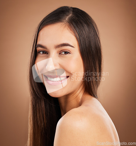 Image of Hair, happy and portrait of woman in studio for wellness, keratin treatment and healthy style on brown background. Salon aesthetic, smile and face of girl with cosmetics, texture and natural beauty