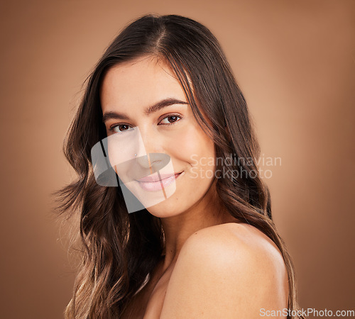 Image of Portrait, beauty and woman in studio for body care, wellness and cosmetics on brown background. Face, relax and female skincare model smile for luxury pamper, self love and grooming routine isolated