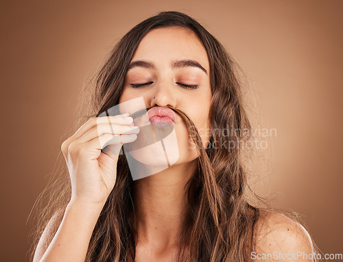 Image of Hair, beauty and face of woman with moustache for wellness, hairstyle and health on brown background. Salon aesthetic, comic and funny girl with cosmetics, keratin texture and natural style in studio