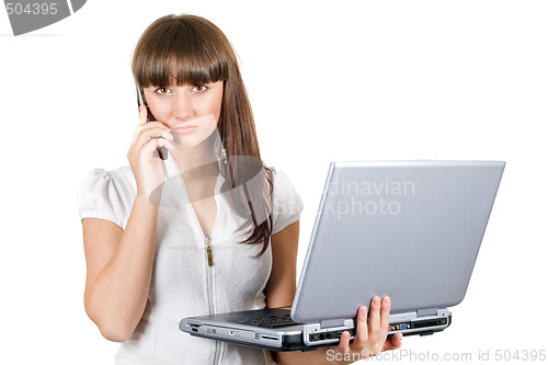 Image of Businesswoman with laptop speaks on the phone