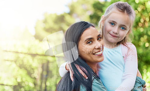 Image of Portrait, outdoor and mother with girl, adoption and happiness on break, bonding and quality time. Face, mama and daughter embrace, hug and smile with joy, adopted and foster mom with female child