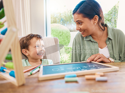 Image of Chalkboard, mother teaching and child learning math, numbers and home development with happy family, help and support. Woman or mom with kindergarten kid and writing discussion for creative education