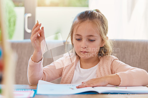 Image of Homework, education and girl with focus, notebook and thinking in living room, studying and learning. Female child, person and student with knowledge, development and ideas for activity and writing