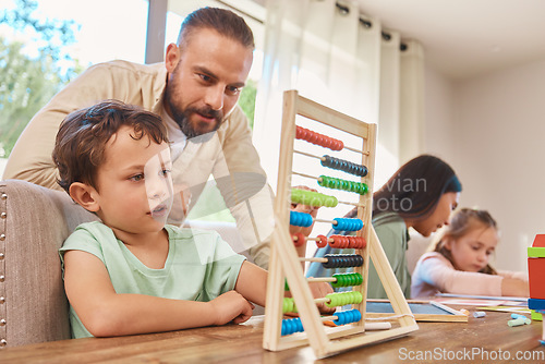 Image of Education, home school and father with his child with abacus helping him work on math homework. Study, knowledge and young dad teaching his son to count mathematics in the dining room of family home.