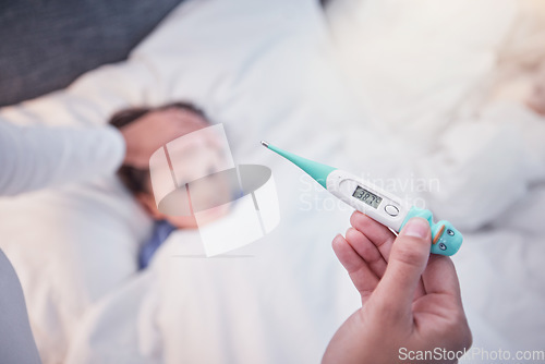 Image of Parent, hands and thermometer with sick child, flu or fever lying on bed under monitoring care at home. Hand of adult checking temperature of kid for illness, healthcare or virus in love and support