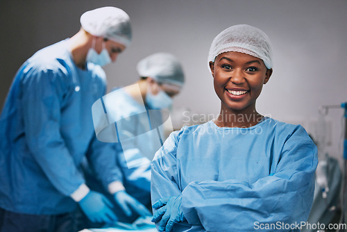 Image of Surgery, portrait and black woman doctor in theater for hospital teamwork, leadership and medical internship. Happy surgeon, nurse or healthcare person arms crossed in operating room or theatre