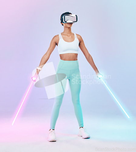 Image of Fitness, virtual reality glasses and woman with lightsaber, futuristic and player against studio background. Female gamer, person or confident girl with vr eyewear, fantasy weapons and laser saber