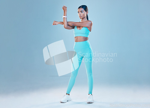 Image of Fitness, warm up and mockup with a sports woman in studio on a gray background for health or wellness. Exercise, arms stretch and space with a young female athlete training for a healthy body