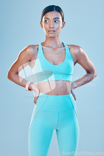 Image of Thinking, body and a woman for fitness in gymwear isolated on a studio background for exercise. Idea, sports and an Indian girl standing in workout clothing for training or a cardio idea for health