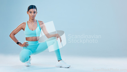 Image of Fitness, focus and space with a sports woman in studio on a gray background for health or wellness. Exercise, mindset and mockup with a young female athlete training for a healthy body or lifestyle