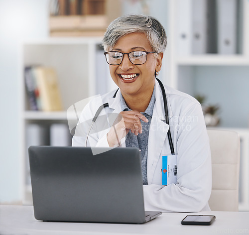 Image of Senior doctor, woman with smile and laptop for video call with virtual medical consultation or research for case. Health insurance, online healthcare conference with happy person and communication