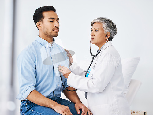 Image of Patient, doctor and stethoscope for cardiology consultation and to breathe for lungs and heart health. Man and medical professional woman listen to heartbeat for healthcare and wellness check