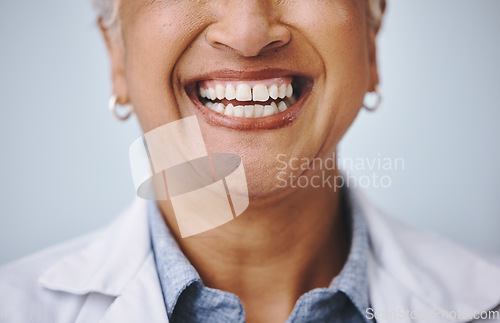 Image of Dental, smile and elderly woman in studio for mouth, hygiene and denture care against grey background. Teeth whitening, cleaning and senior lady happy for oral, tooth and natural looking veneers