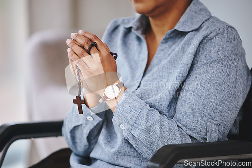 Image of Praying hands, rosary and woman in a wheelchair in prayer, worship and praise closeup. God, pray and female asking, hope and relief of disability, thankful and gratitude to Jesus, faith and guidance