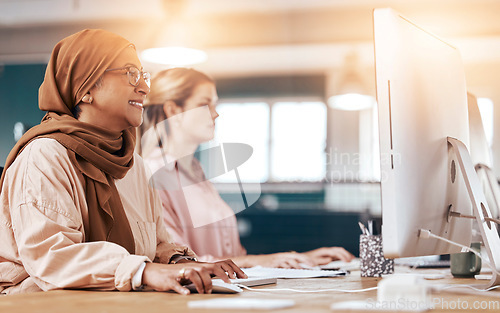 Image of Computer, business office and muslim woman coworking, planning and online management at startup company. Happy diversity people or hijab employee with digital research, website update and desktop pc