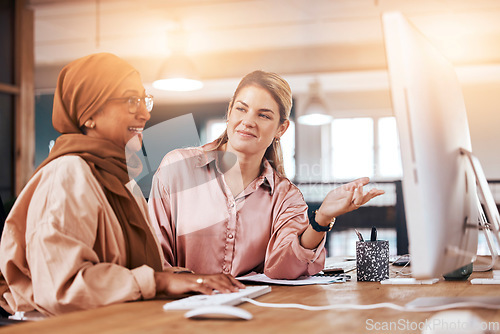Image of Talking, women and training for business on a computer for advice, help and corporate collaboration. Happy, diversity and Muslim employee with a manager speaking, mentoring and helping with pc work