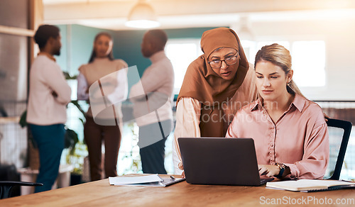 Image of Business people, laptop and serious mentor talking to woman at office desk for motivation. Entrepreneur women together for discussion about management, planning or online training with muslim coach