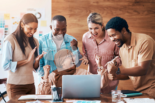 Image of Winning, laptop and business people in teamwork success, office celebration and online news of bonus, target or goals. Winner employees or diversity women and men celebrate with fist pump on computer