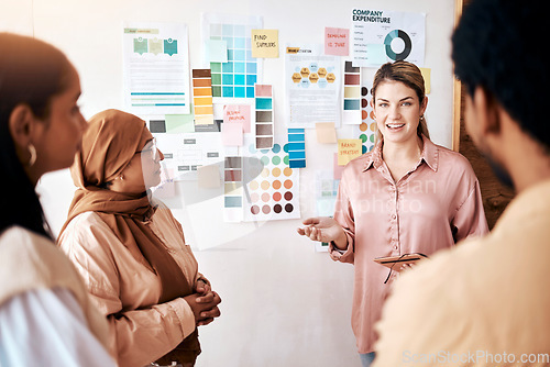 Image of Planning, collaboration and presentation with a business woman talking to her team in the company office. Creative, strategy and teamwork with a female manager teaching or coaching an employee group