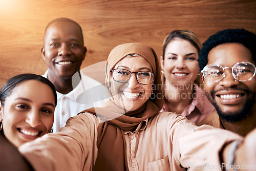 Image of Work selfie, team diversity and portrait of friends in the workplace, happy company and about us. Smile, together and Muslim woman taking a photo with employees for fun, bonding and office memories